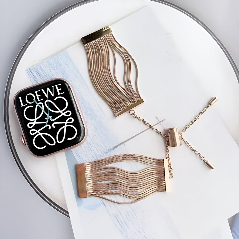 Bracelet Apple Watch or rosé en acier inoxydable avec lanières fines élégantes, pour femme, finition polie.