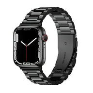 Bracelet Apple Watch homme en acier inoxydable noir, maillons larges, fermoir papillon élégant.