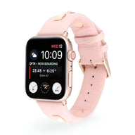 Bracelet Apple Watch femme en cuir rose à rivets, boucle métallisée dorée, taille 38-42 mm.