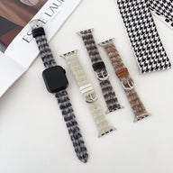Bracelet Apple Watch en cuir et laine tissée motifs pied-de-poule noir, gris, blanc et marron, boucles argentées.