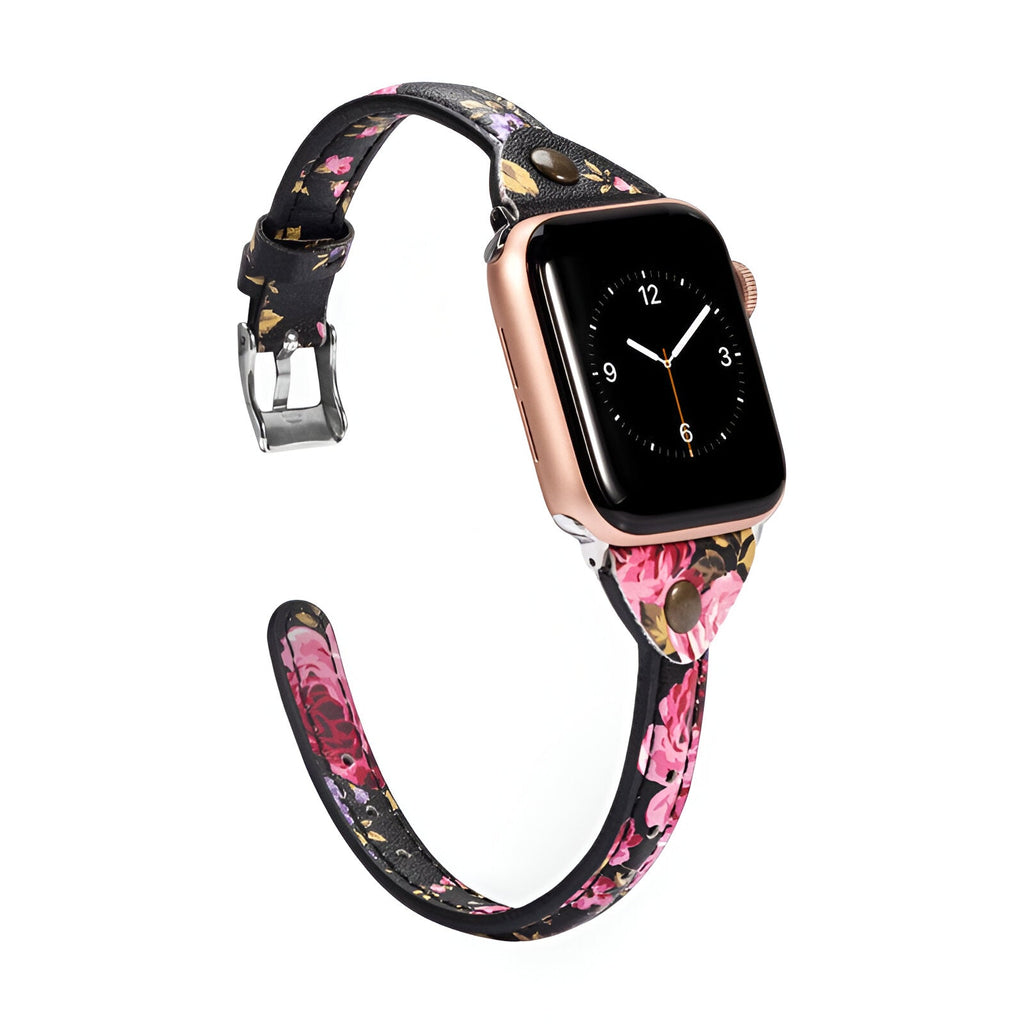 Bracelet Apple Watch noir en cuir avec motifs floraux roses et rose, boucle argentée.