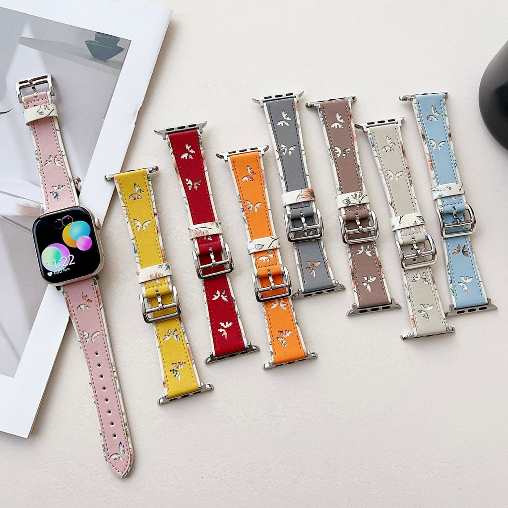 Lot de bracelets Apple Watch en cuir avec motif papillons, couleurs rose, jaune, rouge, orange, gris, marron et bleu.