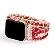Bracelet Apple Watch en jaspe rouge et fils tissés rose avec perles dorées, modèle Finnix.