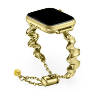Bracelet Apple Watch torsadé en métal doré avec fermeture ajustable, style élégant femme.