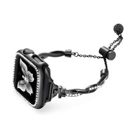 Bracelet Apple Watch femme or noir torsadé en métal avec fermoir coulissant et chaînes fines.