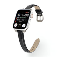 Bracelet Apple Watch en microfibre noir avec boucle argentée, intérieur beige perforé.