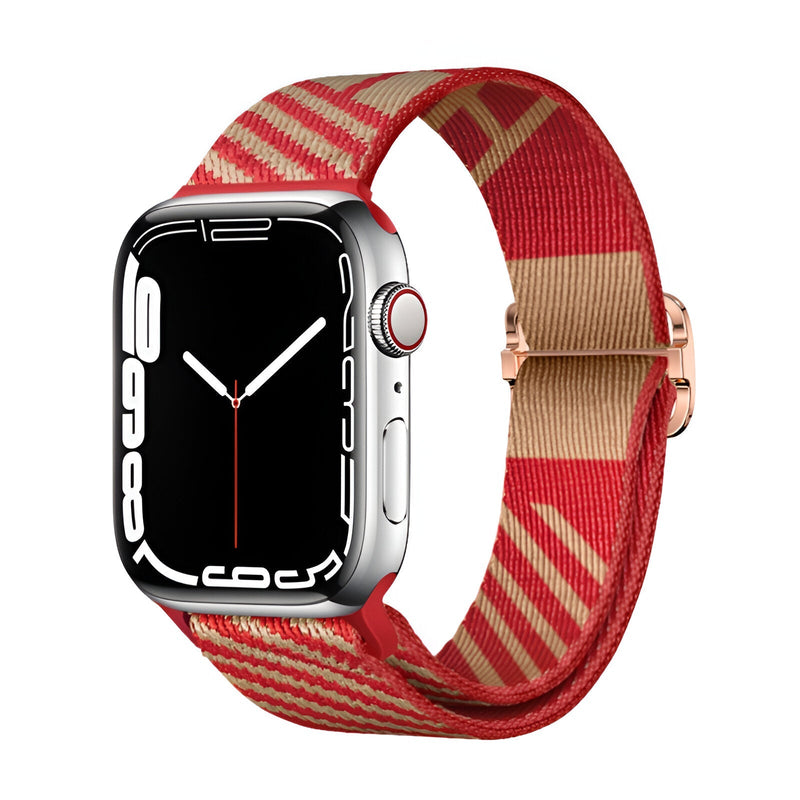Bracelet Apple Watch en nylon rouge et beige à motifs géométriques, boucle argentée.