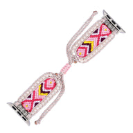 Bracelet Apple Watch en nylon rose avec motif géométrique coloré et bordure en cristal scintillant.