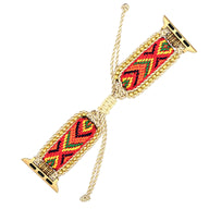 Bracelet Apple Watch en nylon rouge avec motif géométrique noir et jaune, attaches dorées et lien ajustable en cordon doré.