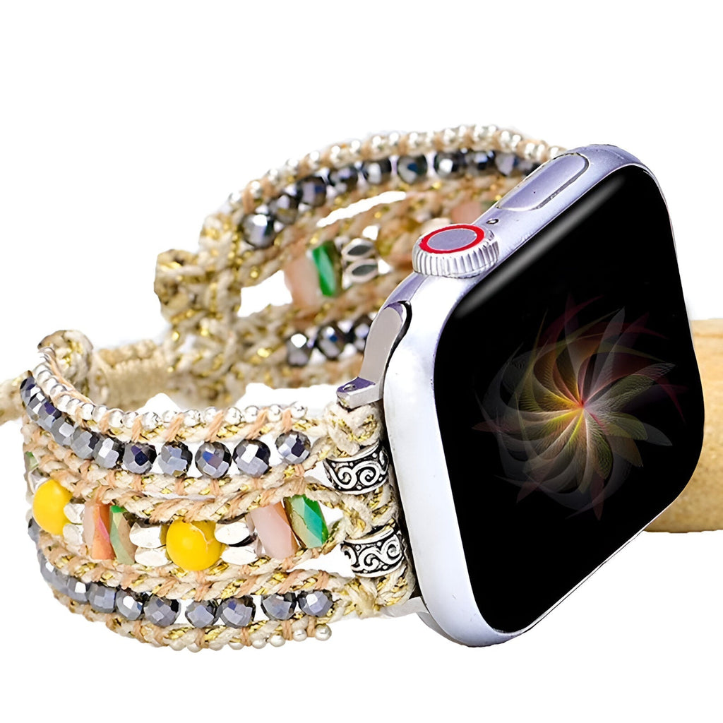 Bracelet Apple Watch femme en nylon tressé multicolore avec cristal et breloques argentées.