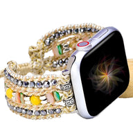 Bracelet Apple Watch femme en nylon tressé multicolore avec cristal et breloques argentées.