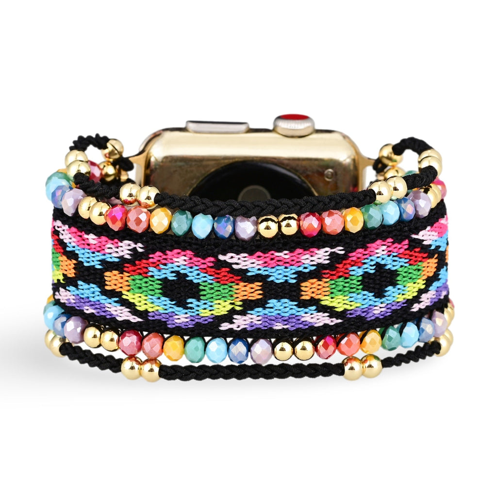 Bracelet Apple Watch femme en nylon multicolore avec motifs géométriques et détails en cristaux dorés.