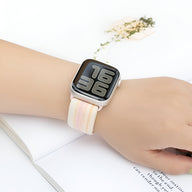 Bracelet Apple Watch en nylon blanc avec rayures roses et jaunes, taille 38-42 mm.