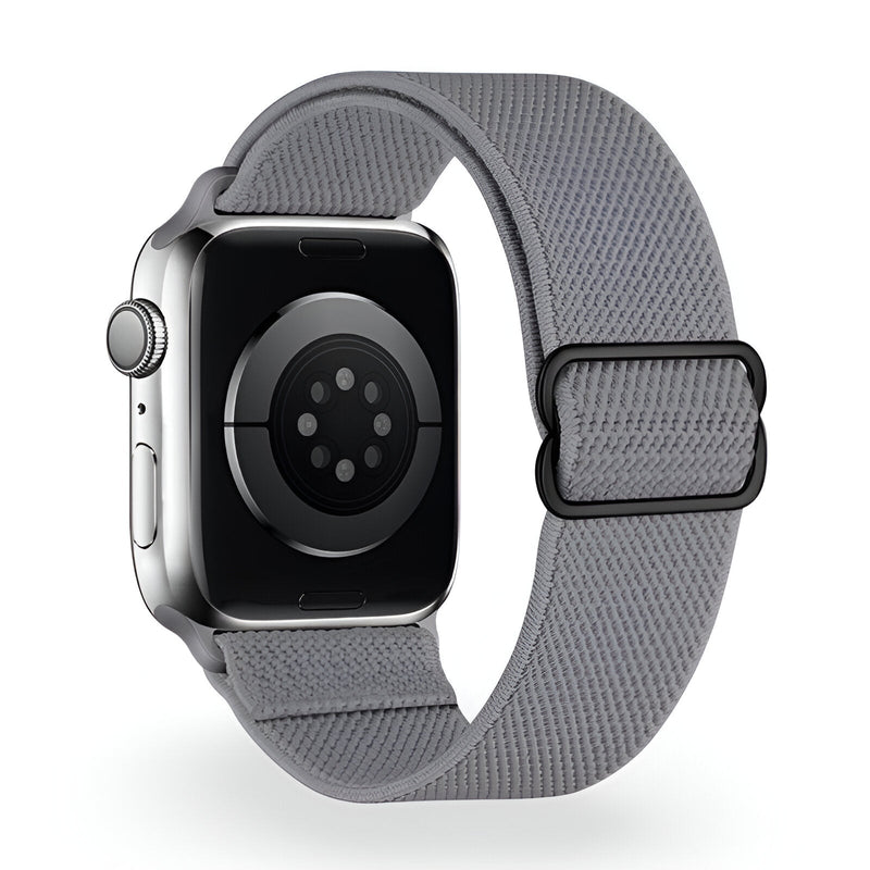 Bracelet Apple Watch en nylon gris clair, boucle noire, style moderne et ajustable.