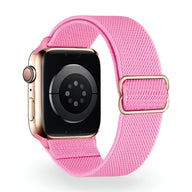 Bracelet Apple Watch en nylon rose vif modèle Zyra avec boucle dorée ajustable.