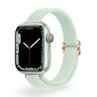 Bracelet Apple Watch en nylon tressé blanc cassé avec boucle en métal doré rose.