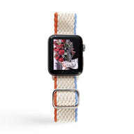 Bracelet Apple Watch en nylon tressé blanc avec bordures orange et bleu, style Riel, pour femme.