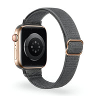 Bracelet Apple Watch en nylon tissé gris foncé avec boucle métallique rose doré.