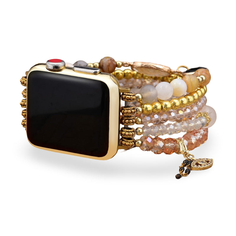 Bracelet Apple Watch or serti de pierres de cristal multicolores et perles dorées pour femme.