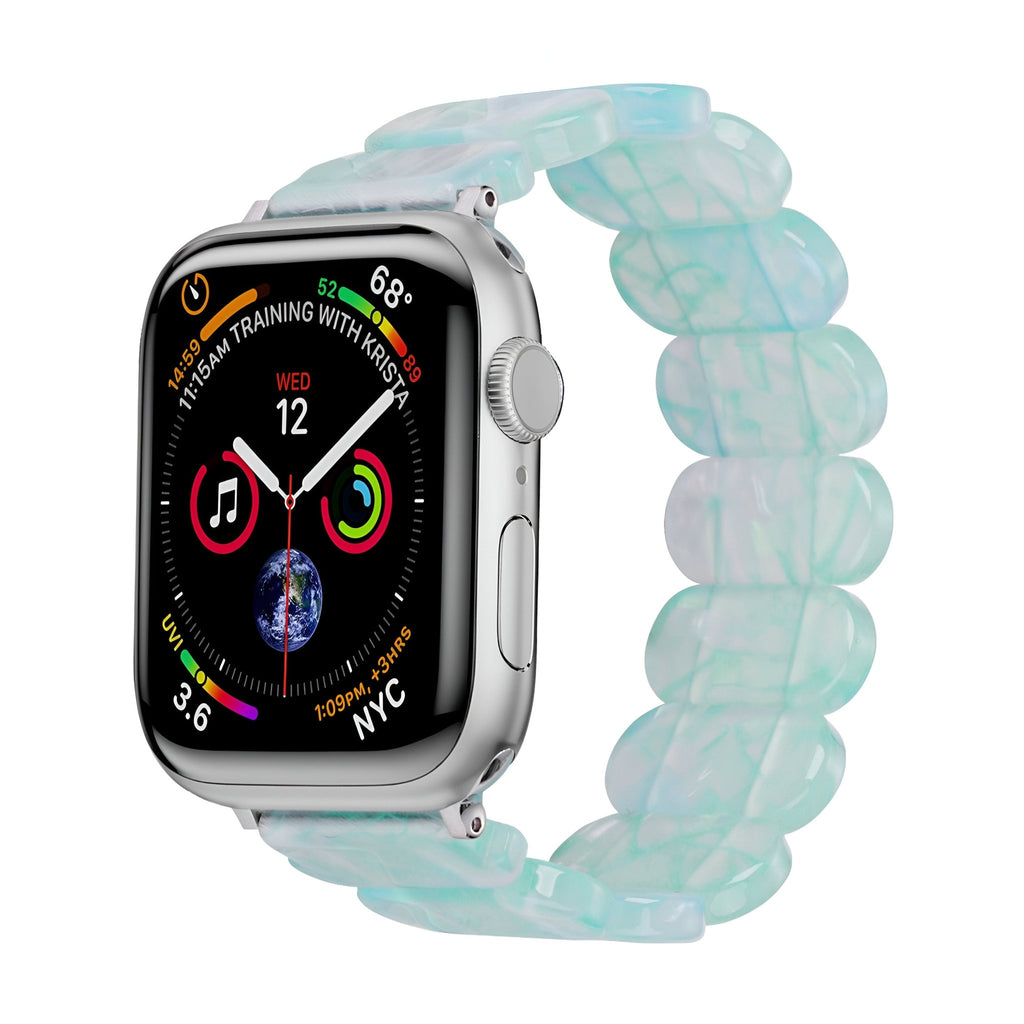 Bracelet Apple Watch en résine translucide bleu clair, maillons larges et souples, pour femme modèle Ilya.