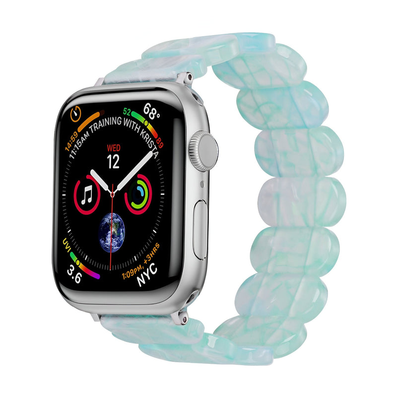 Bracelet Apple Watch en résine translucide bleu clair, maillons larges et souples, pour femme modèle Ilya.