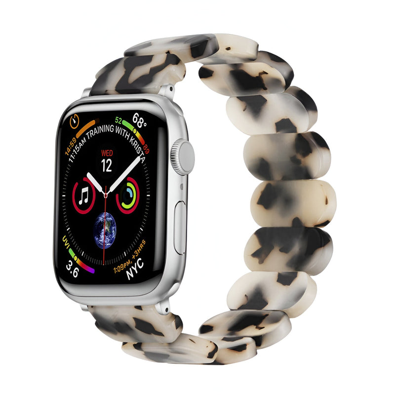 Bracelet Apple Watch en résine blanc tacheté noir, style chaîne élégante, pour femme.