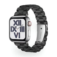 Bracelet Apple Watch femme en résine transparente noire, maillons larges, fermoir métallique argenté.