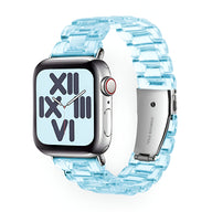 Bracelet transparent en résine bleu clair pour Apple Watch, style maillons larges.
