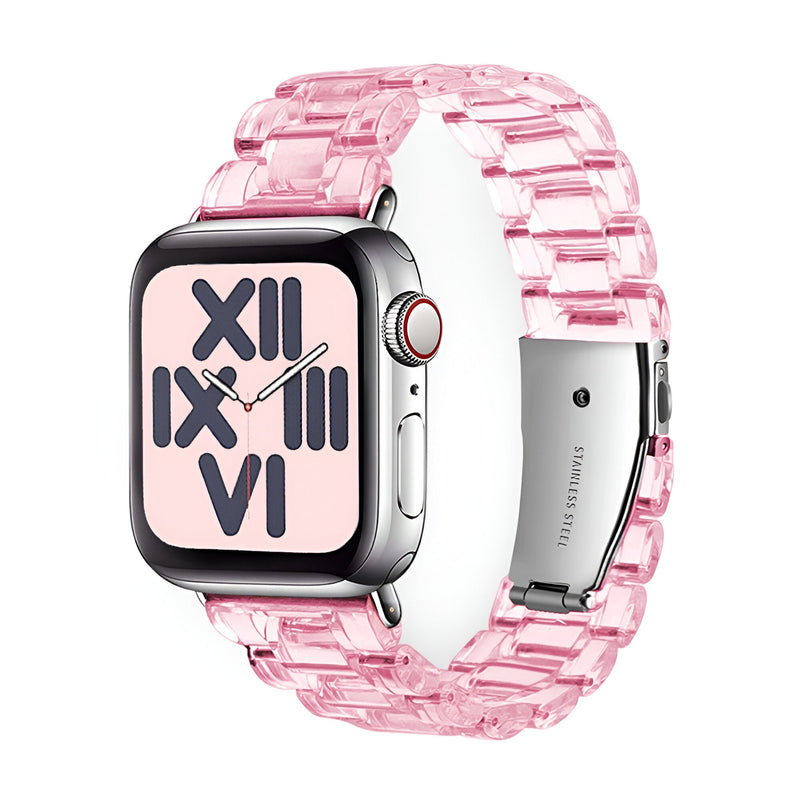 Bracelet Apple Watch en résine transparente rose avec maillons larges et fermoir métallique argenté.