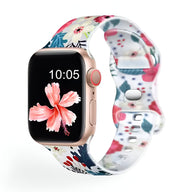 Bracelet Apple Watch en silicone blanc à motif floral multicolore pour femme.