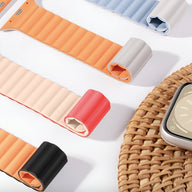 Bracelets Apple Watch en silicone sportifs beige, orange, noir et rouge, design coussins d’air, multiples tailles.