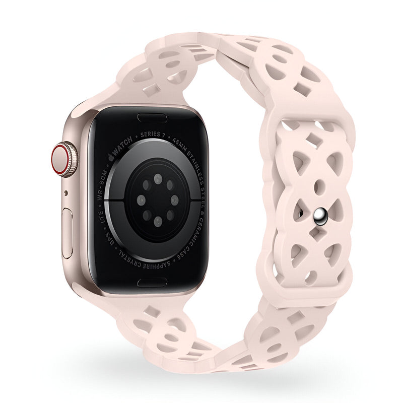Bracelet Apple Watch en silicone beige clair avec motif ajouré et boucle à ardillon métallique rose doré.