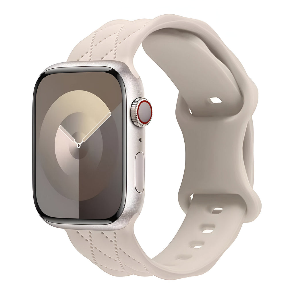 Bracelet Apple Watch Caliope en silicone beige clair avec fermoir ajustable et texture souple.