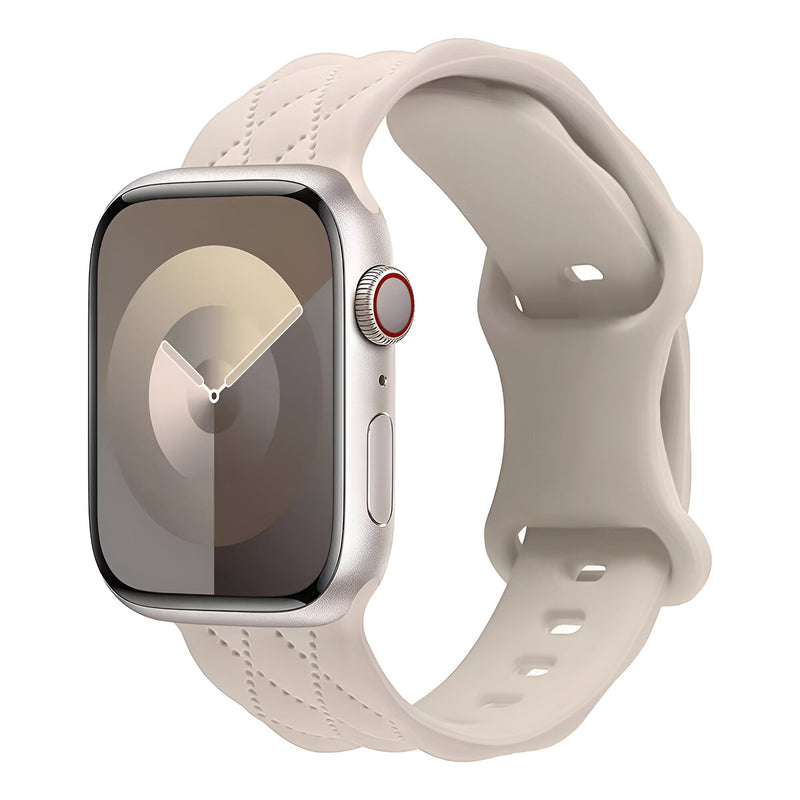 Bracelet Apple Watch Caliope en silicone beige clair avec fermoir ajustable et texture souple.