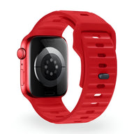 Bracelet Apple Watch silicone rouge vif modèle Kylix, fermeture à boucle, design ajouré et ajustable.