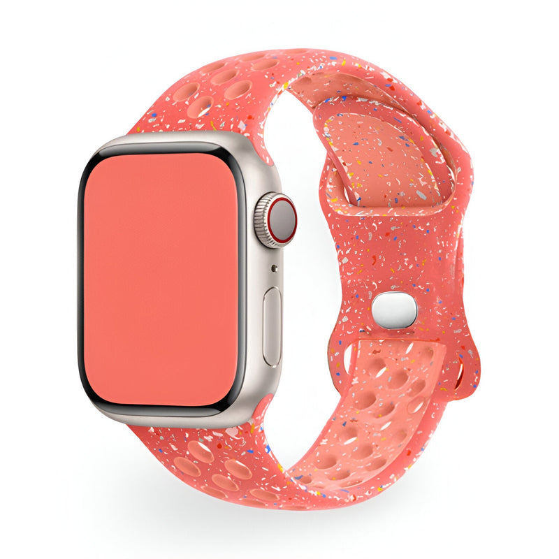 Bracelet Apple Watch silicone rose à motifs multicolores perforé style sport.