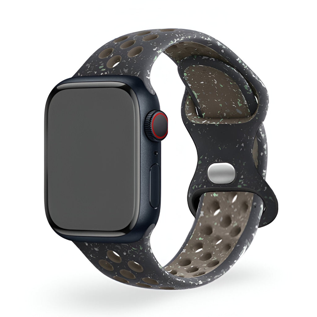 Bracelet Apple Watch Nyro en silicone gris foncé à perforations et éclaboussures blanches, taille 38-42 mm.