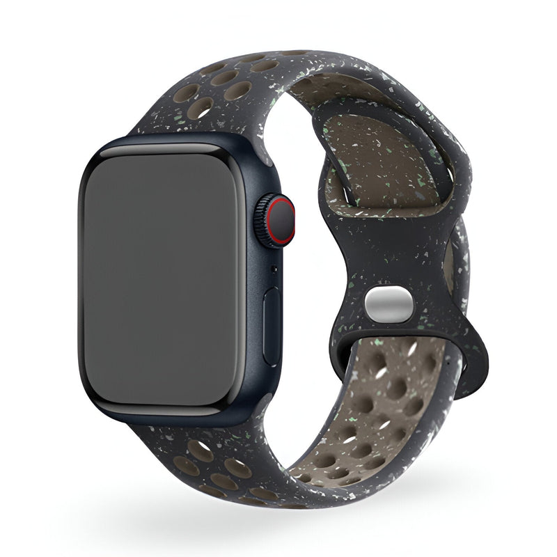 Bracelet Apple Watch Nyro en silicone gris foncé à perforations et éclaboussures blanches, taille 38-42 mm.