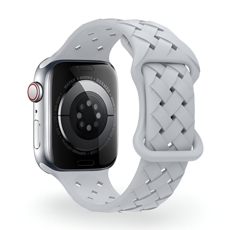 Bracelet silicone blanc tressé pour Apple Watch, fermeture ajustable.