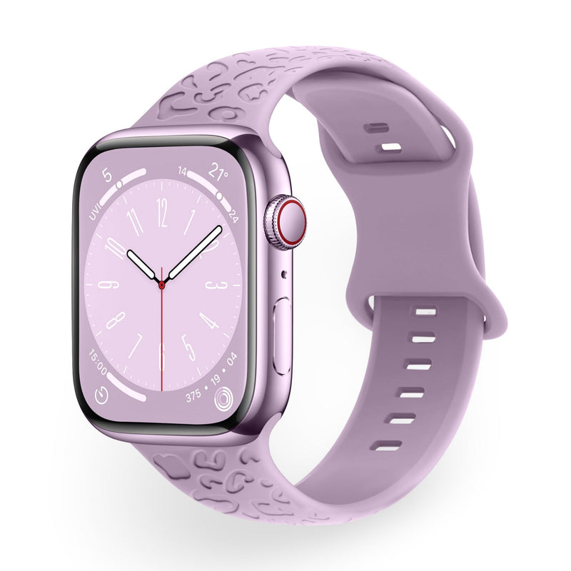 Bracelet Apple Watch en silicone violet clair avec motif gaufré et fermeture à boucle ajustable.