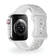 Bracelet Apple Watch en silicone blanc avec motif floral en relief, style mixte, modèle Nexus.