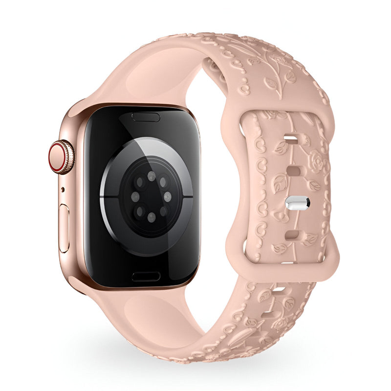 Bracelet Apple Watch en silicone rose clair avec motif floral en relief, modèle Nexus.