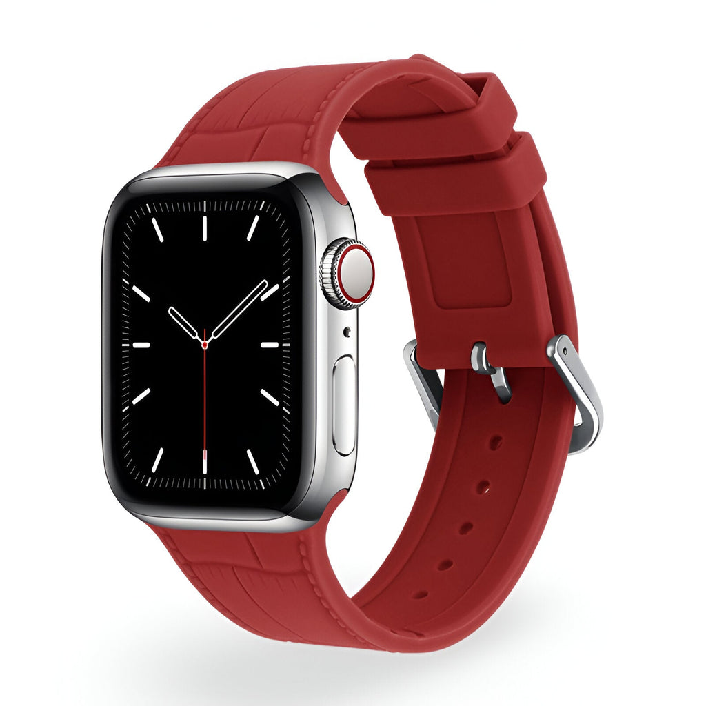 Bracelet en silicone rouge texturé pour Apple Watch avec boucle en métal argenté.