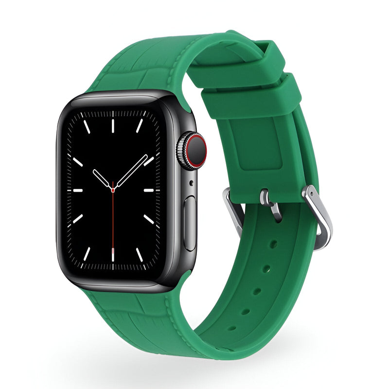 Bracelet Apple Watch en silicone vert pour femme, modèle Zora, boucle ardillon argentée.