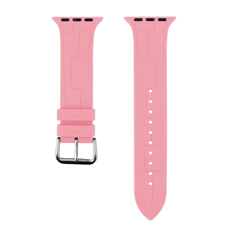 Bracelet Apple Watch en silicone rose pour femme avec boucle métallique argentée.