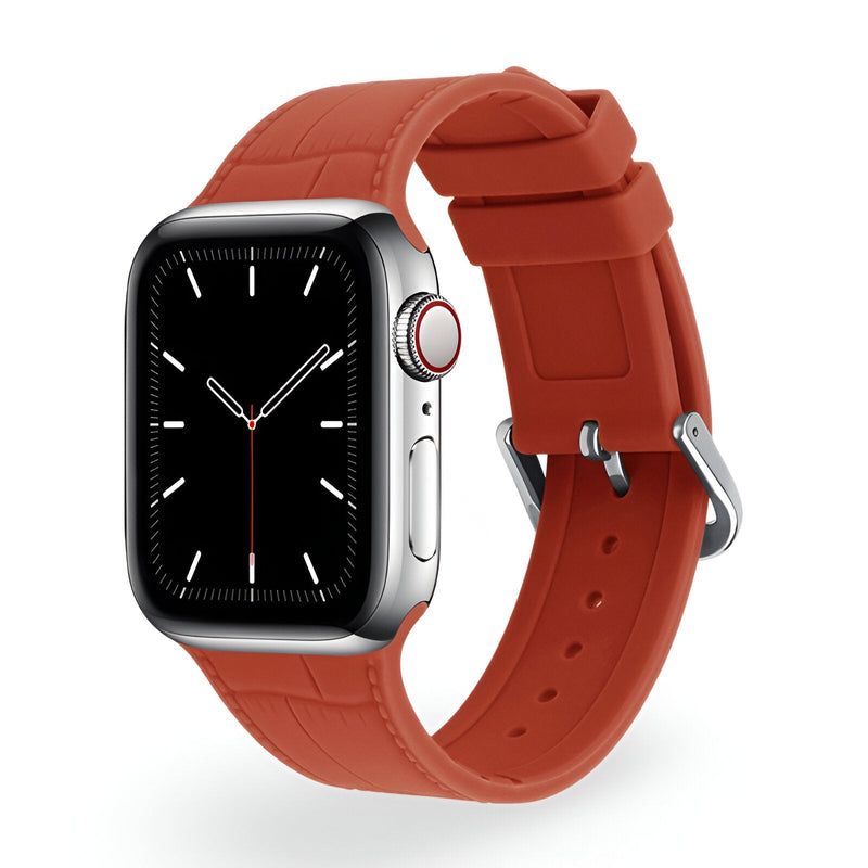 Bracelet Apple Watch en silicone orange, style texturé, boucle métallique brillante.