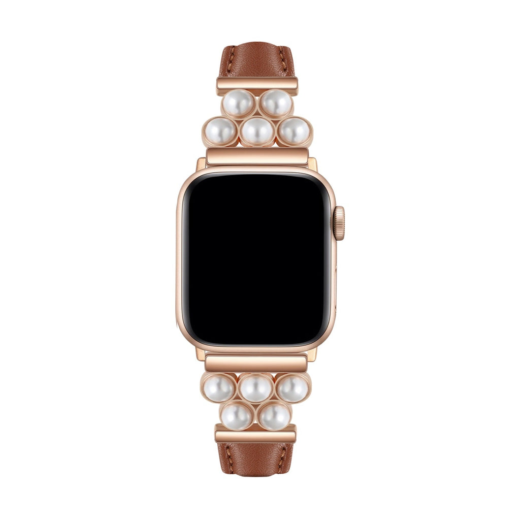 Bracelet Apple Watch en simili cuir taupe avec perles blanches sur un boîtier doré rose.
