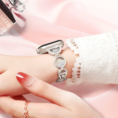 Bracelet argenté pour Apple Watch avec incrustation de sable et motif circulaire bijou délicat.