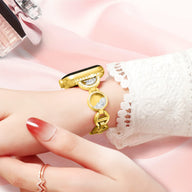 Bracelet Apple Watch or rosé incrusté de sable avec maillons ronds et brillants pour femme.