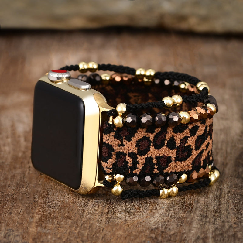 Bracelet Apple Watch larges motifs léopard marron avec perles noires et dorées, style Cira pour femme.